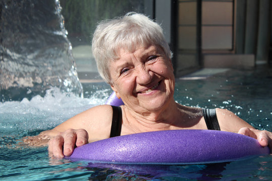 senior woman swimming in a pool