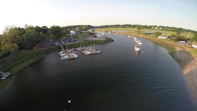 Boats moored at Southport Harbor, Connecticut USA, aerial flyover footage.