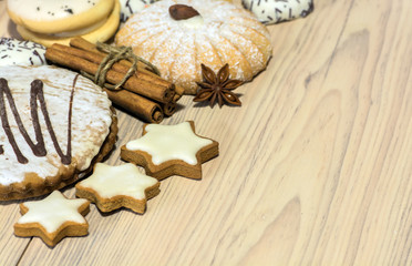 Gingerbread cookies with different shapes, cinnamon sticks and star anise grains