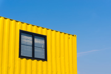 yellow container with background blue sky