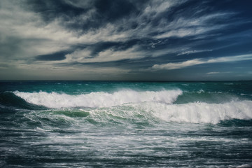 Stormy ocean landscape with rainy clouds