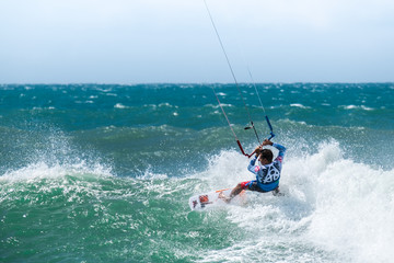 Amazing kite surfing at Philippines. Processional instructor surfing in ocean waives © PerfectLazybones