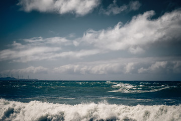 Stormy ocean landscape with rainy clouds