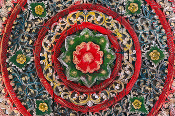 Pattern of flower carved on wood background. hand made in asia