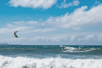 Amazing kite surfing at Philippines. Processional instructor surfing in ocean waives