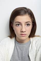 Portrait of a teenager with a serious face.