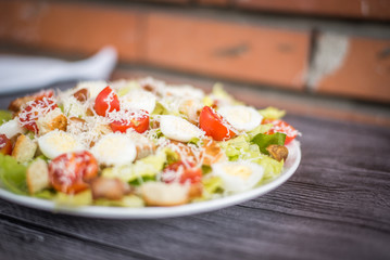 Healthy Grilled Chicken Caesar Salad with Cheese and Croutons