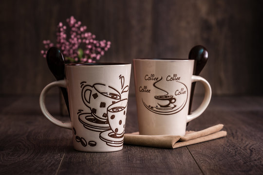 White, Brown Ceramic Coffee Mugs on Wooden Background