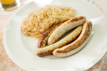 Bavarian traditional meal with sausages and cabbage on the plate