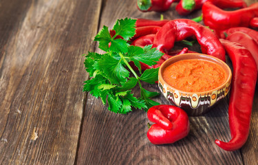 Homemade sauce and red hot chili peppers and celery