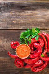 Homemade sauce and red hot chili peppers and celery