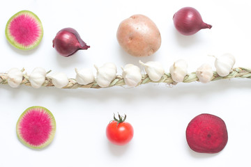 Knitted garlic, slice radish, slice beets, twig red tomatoes and