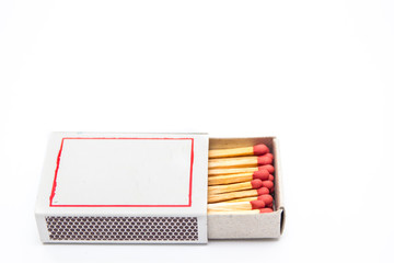Matches stick in paper box close up isolated.