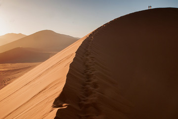 Fototapeta na wymiar climbing in namibian desert
