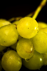 Bunch of grapes on a black slate stone