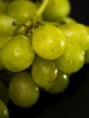 Bunch of grapes on a black slate stone