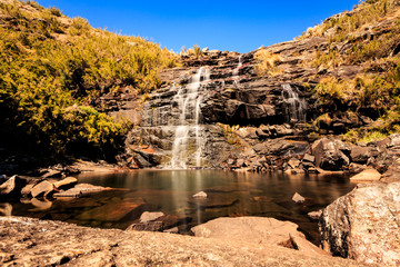 Peaceful Waterfall ant it's lake in the midle of the rocks and forest