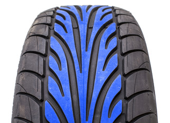 Wet weather tire with blue color tread in the middle of contact area pattern, isolated on white...
