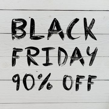 Black friday 90% off brush hand lettering on white painted rustic barn wooden planks. Sale banner.