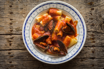 Pasta with stuffed mussels and tomato sauce