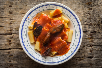 Pasta with stuffed mussels and tomato sauce