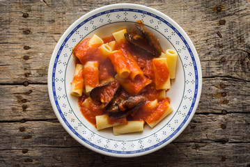 Pasta with stuffed mussels and tomato sauce