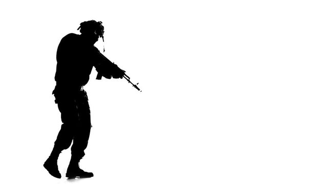 Man dressed in camouflage clothes. Silhouette