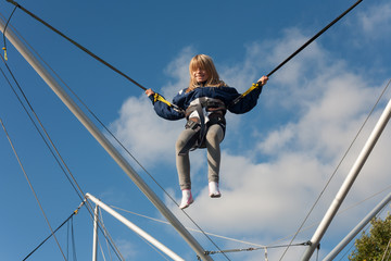 Little girl enjoying jumping