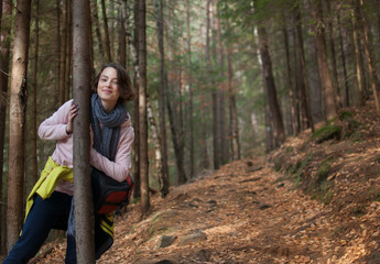 Naklejka na ściany i meble Girl in the forest. adventure, travel, tourism, hike.
