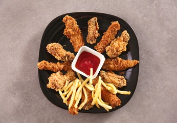 Grilled chicken on a plate standing the wooden table