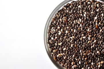 Chia seeds (Salvia hispanica) close-up isolated on white with copy space