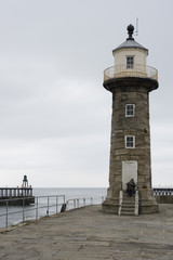 Old stone lighthouse, East Pier, Whitby