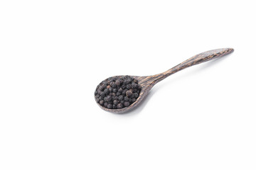 Black pepper in spoon wooden bowl isolated on white background