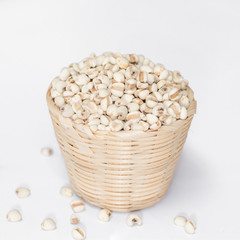 Millet rice , millet grains in bowl Bamboo Basket on white