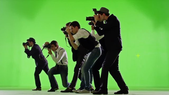  Group of paparazzi. Photo shoot on green screen. Slow motion. Shot on RED EPIC Cinema Camera.