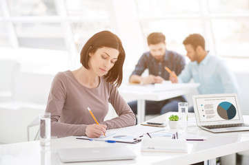 Successful businesswoman and business team at office meeting