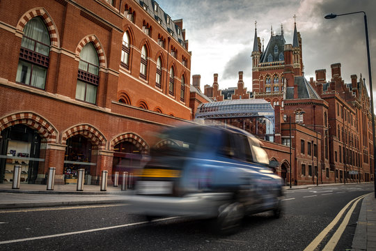 Exterior Shot Of St Pancras International Train Station And A Black Cab Taxi In London, England, UK