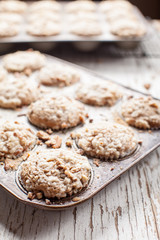 Walnut crumb sweet potato muffins in an old tin macro shot