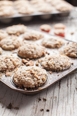 Walnut crumb sweet potato muffins in an old tin side view