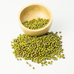 Mung beans in wood bowl isolated on white background