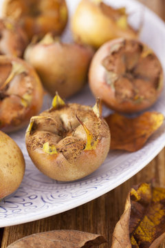 Medlars on Patterened Plate