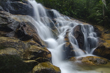 beautiful in nature, amazing cascading tropical waterfall. wet a