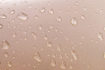 Drops of water on gold metal texture