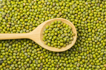 mung beans over wooden background