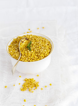 toor dal ( skinned and split pigeon pea ) in a small dish on whi