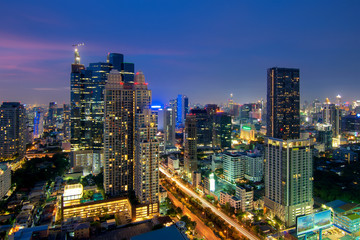 Bangkok night view with skyscraper in Sathon Silom, Thailand