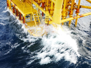 High wave hitting the Boat Landing and Producing Slots at Offshore Platform during bad weather...