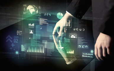 Businessman touching interactive modern desk with technology ico