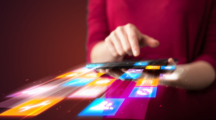 Fototapeta premium Hand holding tablet device with media application