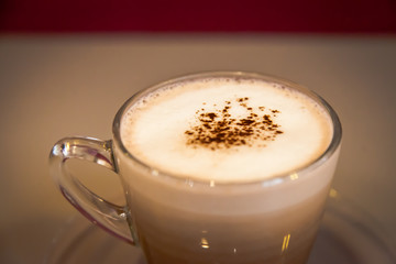 Hot drink isolated put on the table with red background at coffee shop; delicious favor chocolate and coffee.